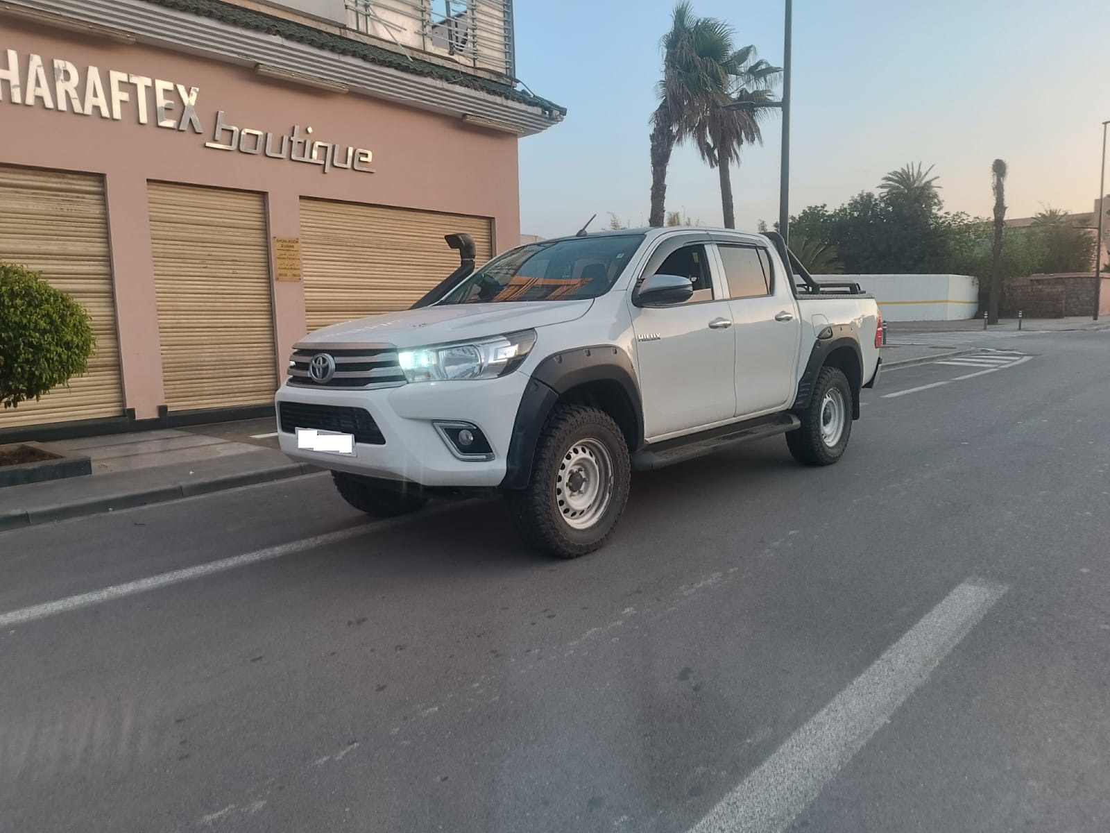 Rent a Camper Van in Morocco | Airport Transfers | Fiat Ducato Camper A 4x4 driving on a city street.